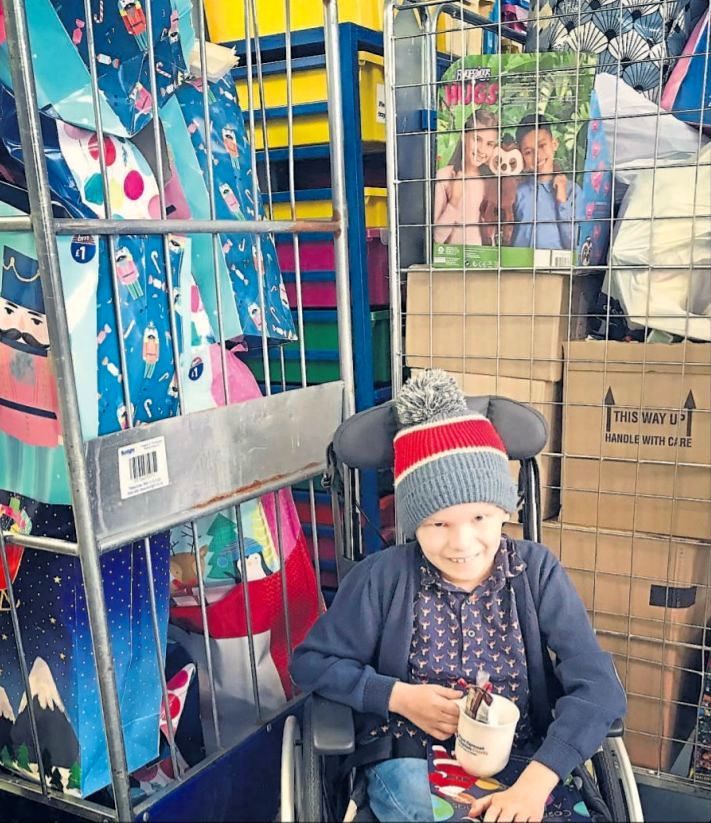 Elliott Furse with some of the presents he collected in December 2020 Picture: Furse family