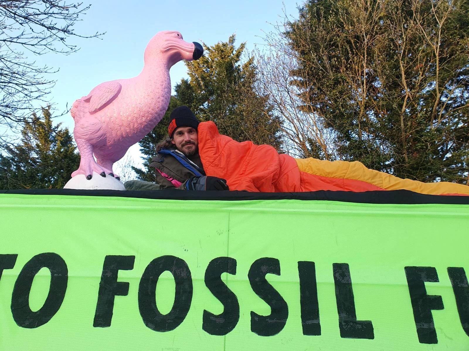 One of the protestors shows the giant pink dodo on top of the van Picture: XR