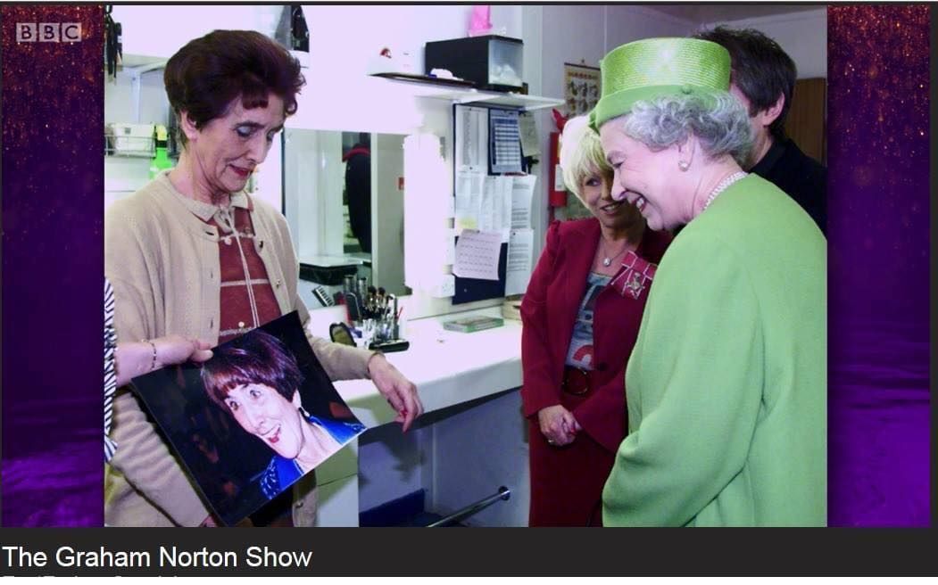 June showing the Queen the photo that James took of her, as shown on the Graham Norton Show