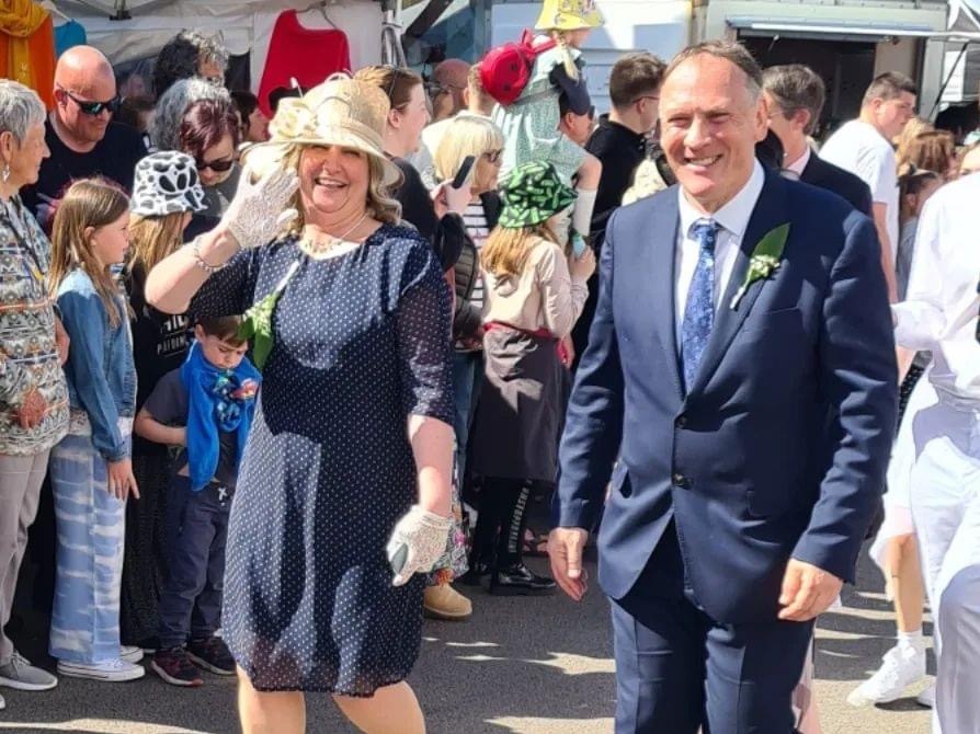 Wayne and Clair Day walking alongside the Childrens Dance on Flora Day 2022