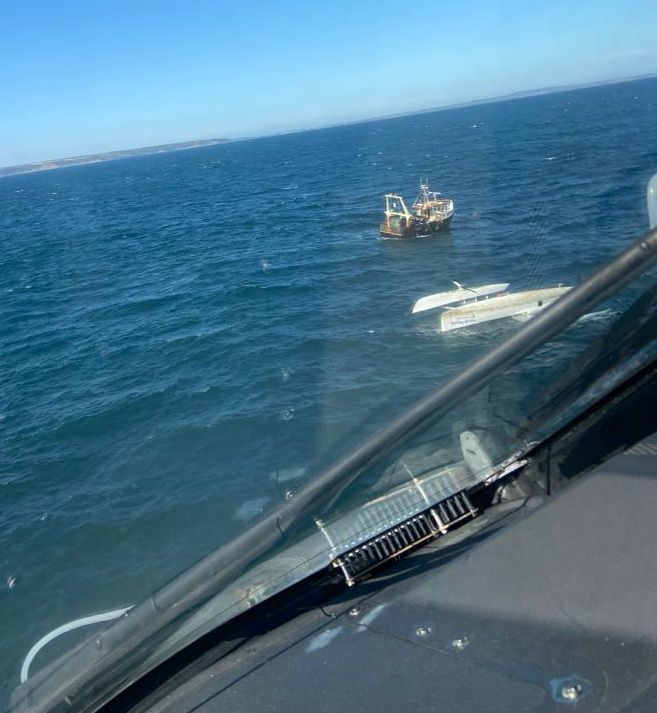 Looking from the 814 NAS helicopter at the upturned boat off Cornwall Picture: Royal Navy