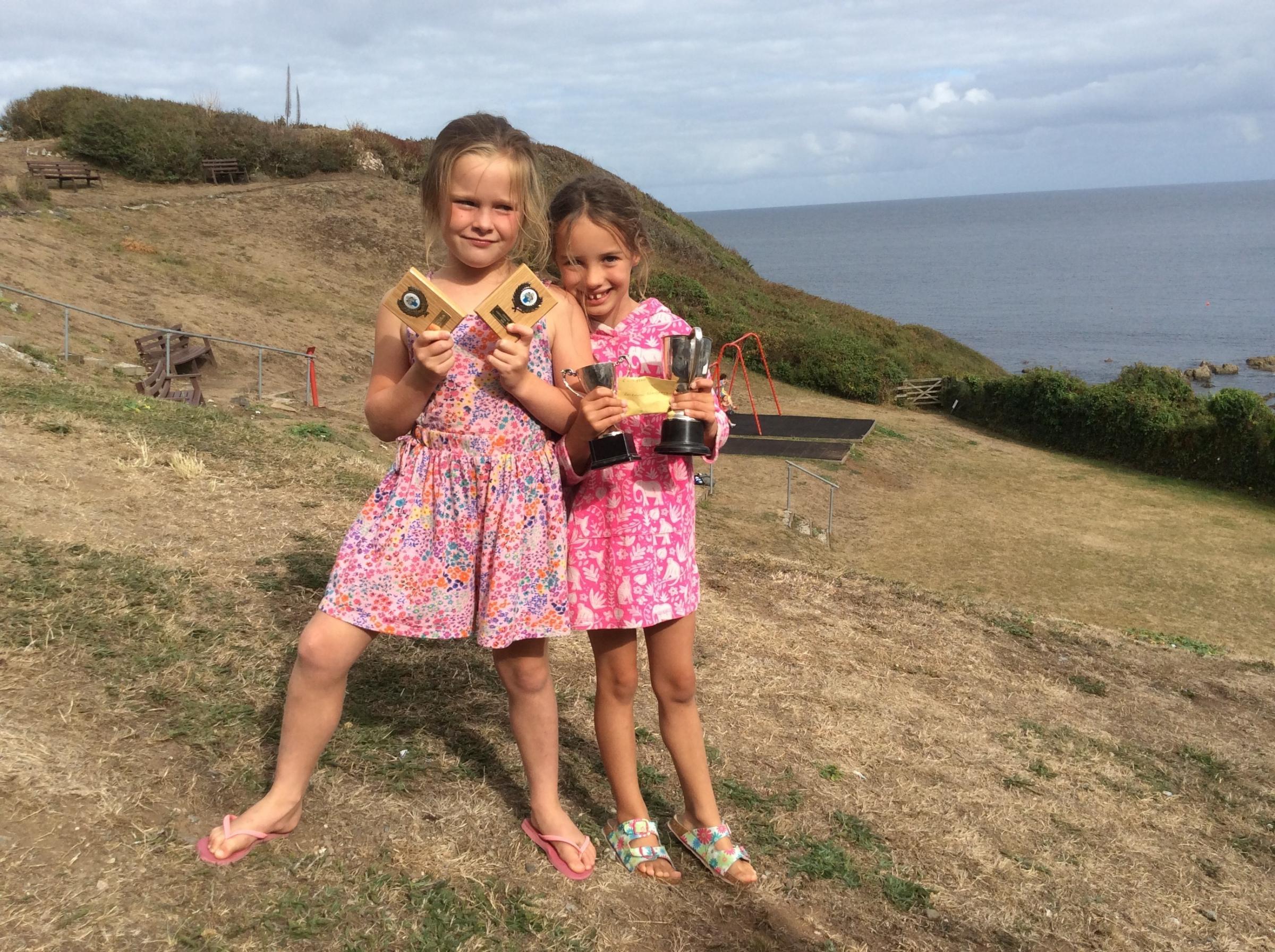 Twins Arabella and Rosenwyn Brandreth with a good haul of trophies from the childrens section