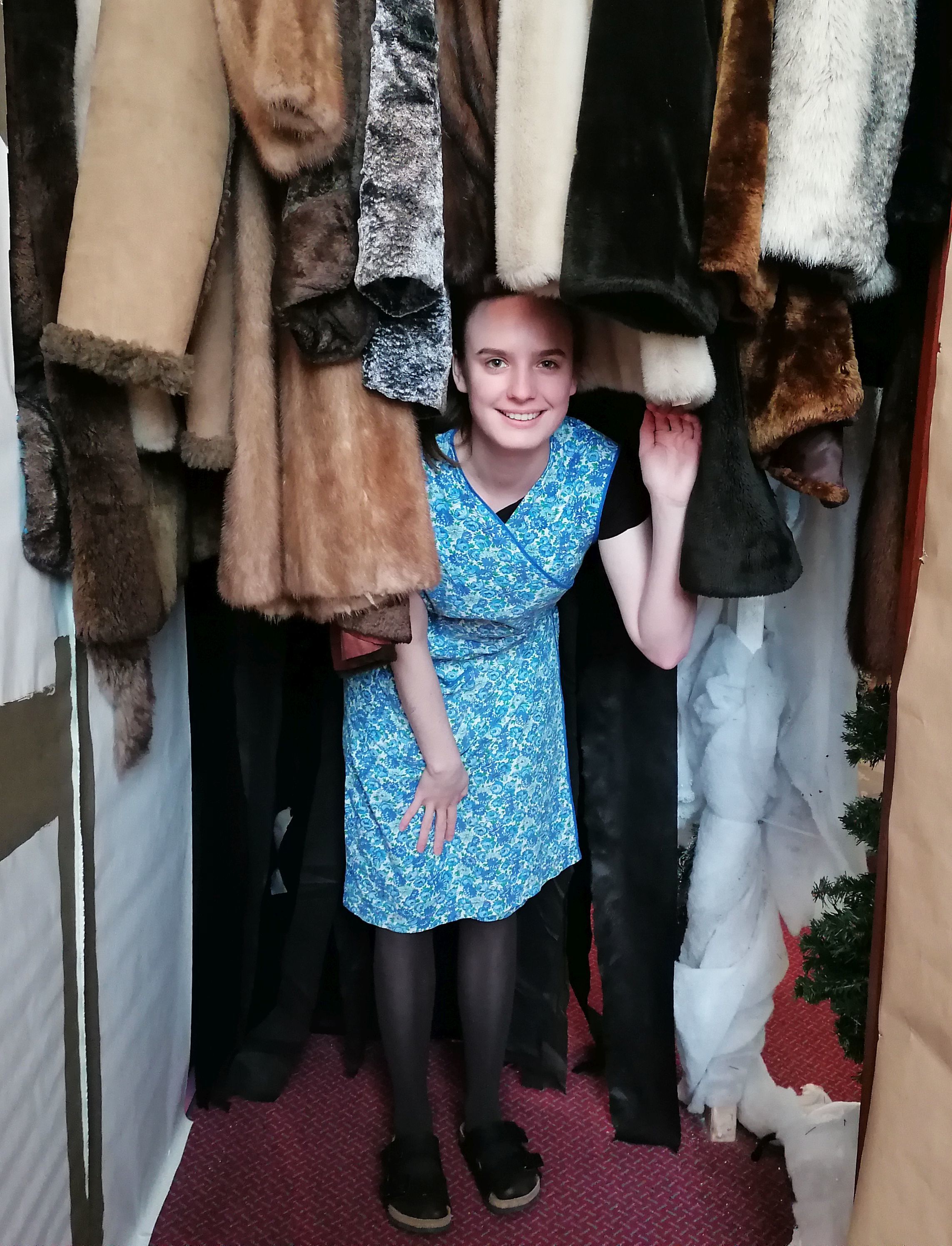 Alice Attenberger welcomes people through the wardrobe