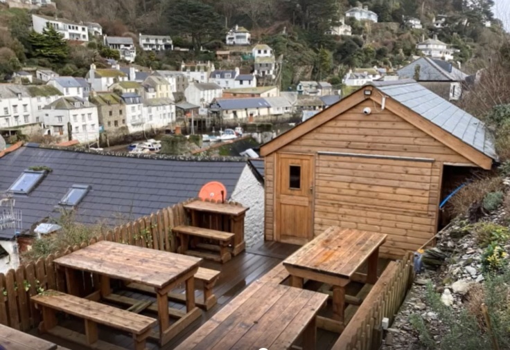 The new timber bar structure at the rear of the Three Pilchards pub, which was built without planning permission (Pic: Cornwall Council)